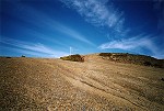 The track crosses a gravel ridge