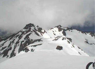 Clouds split to reveal the north peak