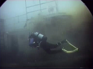 Divers swimming alongside one of the wrecks...