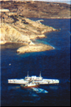 The former Gozo ferryboat is positioned by tugboats prior to being scuttled at ix-Xatt l-Ahmer in Gozo. Click to enlarge...