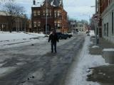 Scott standing on the oldest paved street in the U.S.