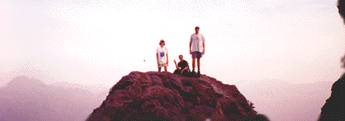 Dianne, Jacqueline and Mike stand/sit atop the Bunion