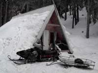 Rutherford Creek Cabin with Rob's snowmobile in front