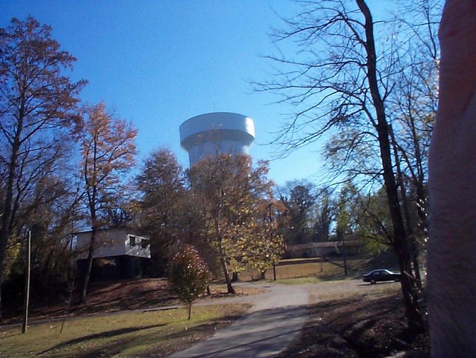 water tower above the river and park