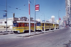 #1113 running as Line #26 and #127 running as Line #15 sharing a stop in Ras el-Tin Palace Street, Alexandria, Egypt. April 2001.