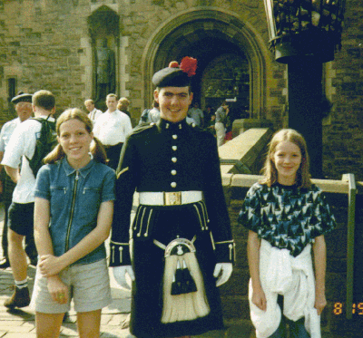 My sis and I with one of the Edinburg castle 'guards'