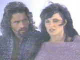 Xena in pink(?!) and Ares looking concerned.