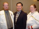 A photo of Jill, her husband, and Mr. George Takei. Get permission from all parties before downloading this photo.