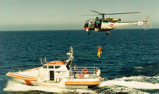 Vittoria Class Sar launch and Alouette SAR helicopter during winching training.