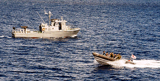 AFM Swift class patrol boat on joint training with Royal Navy rib-dinghy from HMS Northumberland.