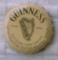 A113. Guiness Stout Cap brewed only for the Armed Forces. It is written on the 2 lower semi-circles as  'duti/cukai tidak dibayar. Untuk Kegunaan Tentera Malaysia Sahaja' meaning 'Duty Not Paid. For Malaysian Atmed Forces Use Only'.