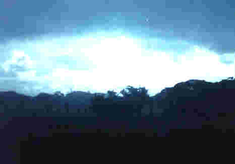 Rain and Sun in Tarlac: Photo from a Waiting Bus by Mila D. Aguilar