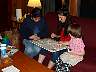 Yvonne, Rachel, and Riverly working on a puzzle