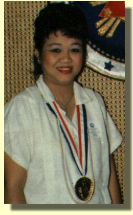Carol poses after receiving the Presidential Award