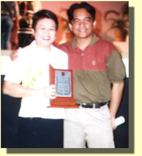 Carol together with MCCID Director Jojo Esposa after winning the Deaf Employee of the Year Award.