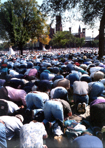 Lots of men, bowing toward the Smithsonian Museum