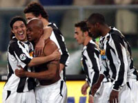 Camoranesi congratulates Olivera who has taken off his jersey top