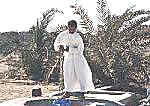 Ali lifts water from a well