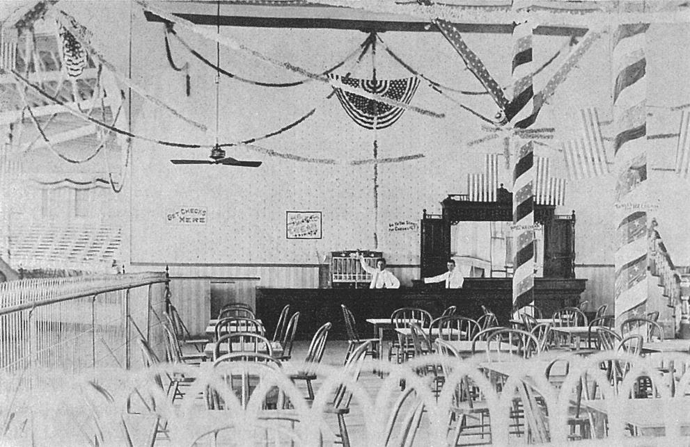 Concession stand inside the Casino.  Note electric fans above, and bleachers in the left background facing the stage.