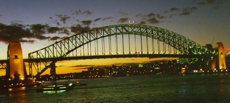 The Harbour bridge lit up at night.