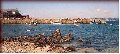 Fishing either from the beach or from the rocks in this little port of Brittany.