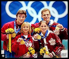 Anton Sikharulidze, Elena Berezhnaya, Jamie Sale, and David Pelletier posed with their golds. AP