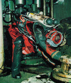 Dirty oil diver in HD suit