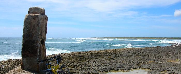 The stone monument marks the eastbound tip of the island