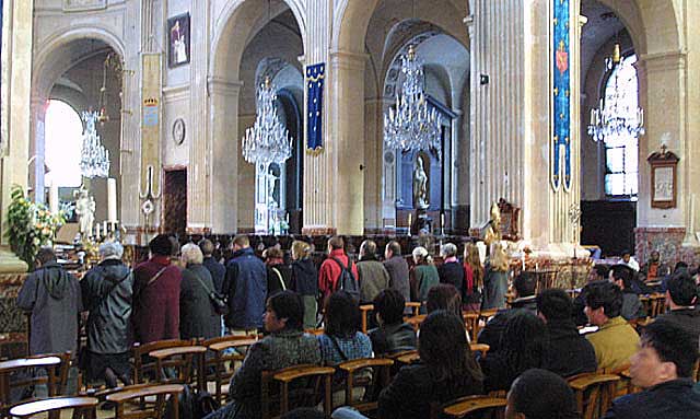 Traditionalists praying at the altar rail.