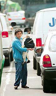 Poor Mexican mother and child begging for money on the streets.