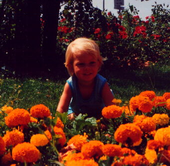 Krizia on a flowerbed at Garda