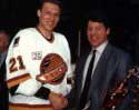 Accepting his second Babe Pratt trophy from Paul Reinhart
