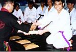 Chris Paguinto receiving his Yellow belt