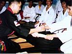 Harold Namocatcat receiving his Yellow belt