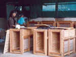 Laurie and Bonnie checking the cubs' crates - Click to enlarge
