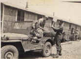 3 guys clowning around at jeep -