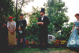 Fred Priebe portraying Abraham Lincoln at the dedication of the Rockton plaque, along with members of the Round Table dressed in period costumes.