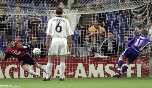 Rebrov takes a penalty shot with Cassilas in the net.