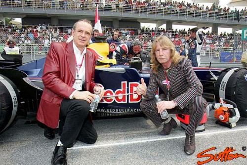 Francis and Rick with a Red Bull car on the grid at Sepang (copyright World@Sutton)