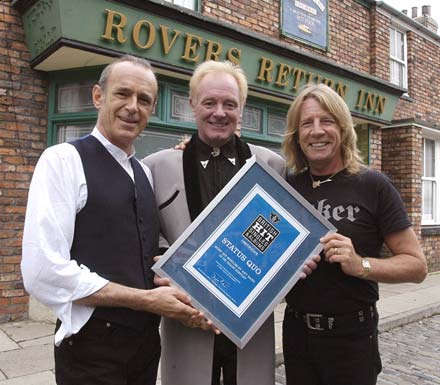 Quo with Les Battersby on the set of Coronation Street receiving their award