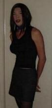 Black top and grey mini skirt