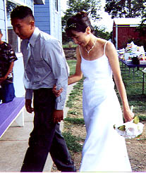 Debbie's brother Joe walking her down the aisle