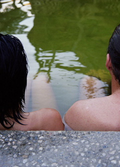 Couple sitting in hot springs