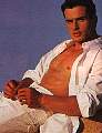 Antonio with shirt open