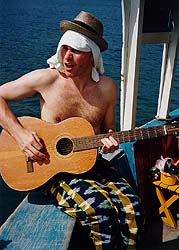 Ed playing a dodgy guitar on a boat in Nha Trang, Vietnam