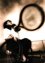 Black and white photograph of wheelchair Tennis Paralympist