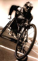 Black and white photograph of Wheelchair track and field paralympist