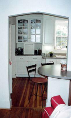 We widened the doorway, added a wraparound counter, and built in the bumpout the equivalent of a butler's pantry.