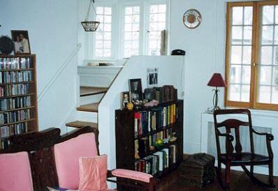 The stairway features a windowseat, storage and a bay window. So of course, that's where Ed lives.