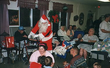 A few of our members and their families, Santa, and the residents of Broman's Nursing Home